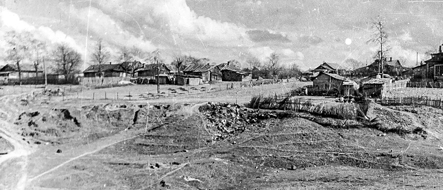 Fili village. A part of the garbage dump can be seen in the center of the photo.