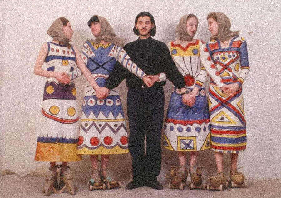 Ostretsov with models wearing dressed designed by him