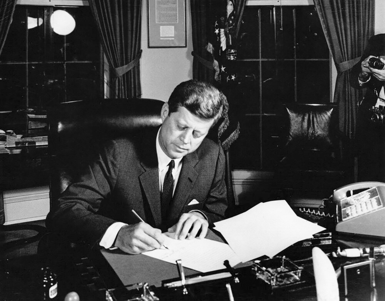 John F. Kennedy signs the interdiction of the delivery of offensive weapons to Cuba. White House, Washington, D.C. 