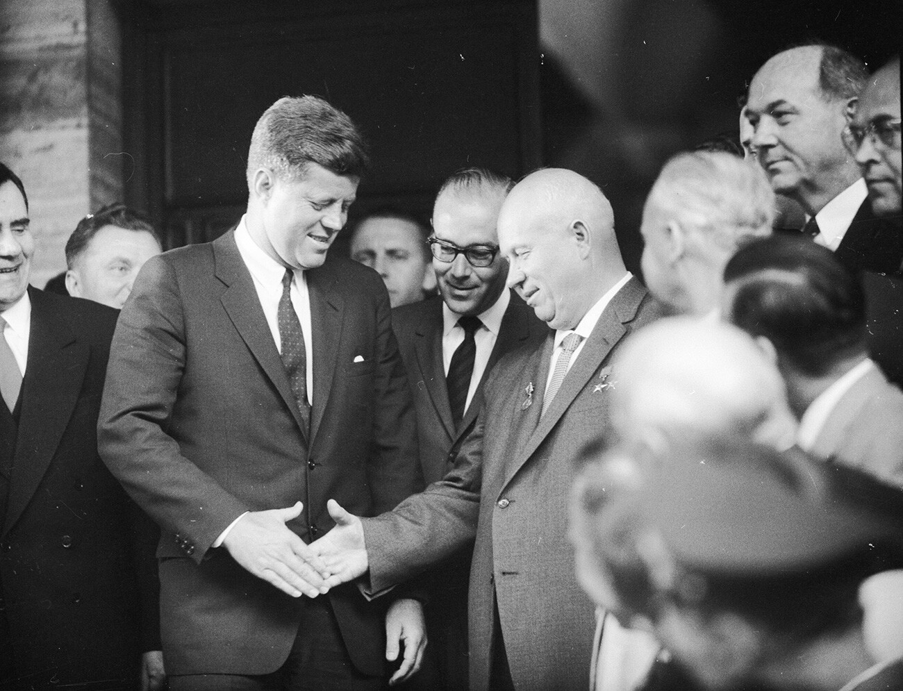 Soviet statesman Nikita Khrushchev, first secretary of the Soviet Communist Party and U.S. statesman John F Kennedy, 35th president of the U.S., shake hands at the U.S. Embassy in Vienna on meeting for talks. 