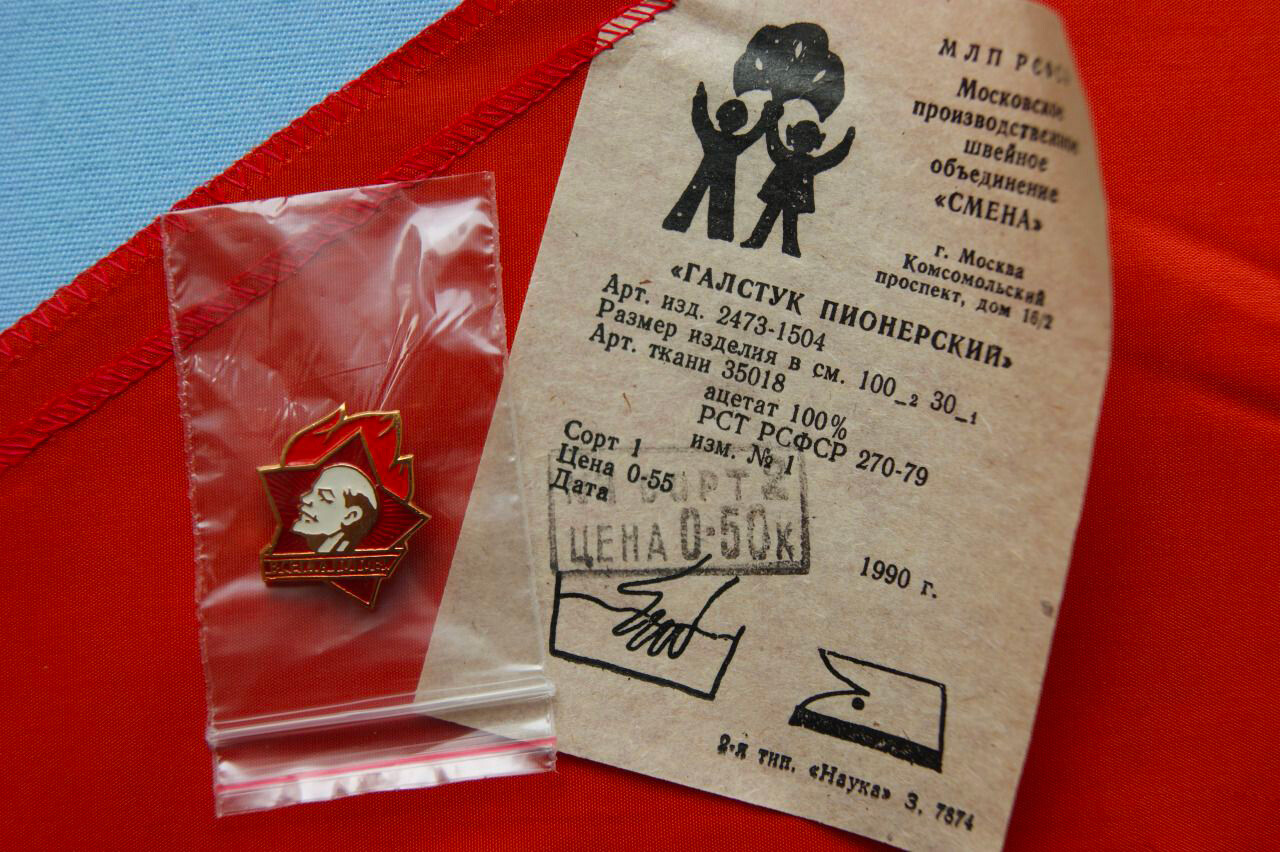 A Pioneer necktie with a Pioneer badge and a price ticket