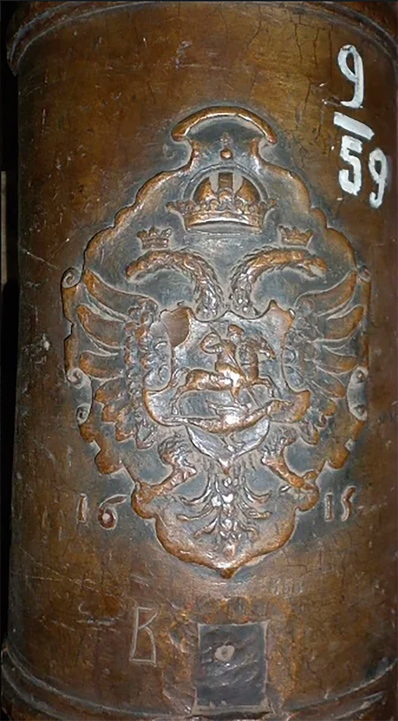 The coat of arms of the Russian State cast on the side of the barrel