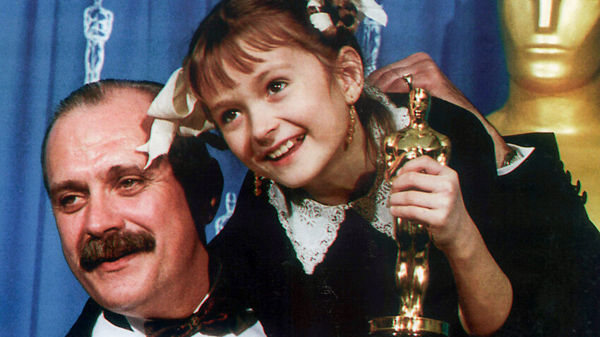 Director and actor Nikita Mikhalkov, winner of the Best Foreign language Film Oscar from his movie "Burnt with the Sun", and his daughter Nadya, who appeared in one of the lead roles in that movie, holding Oscar figurine