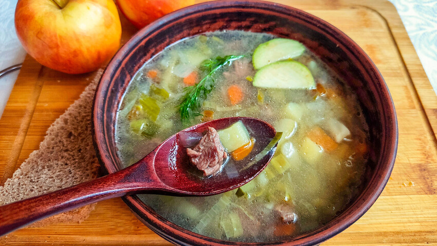 An original soup with vegetables, fruit and meat mixed together.