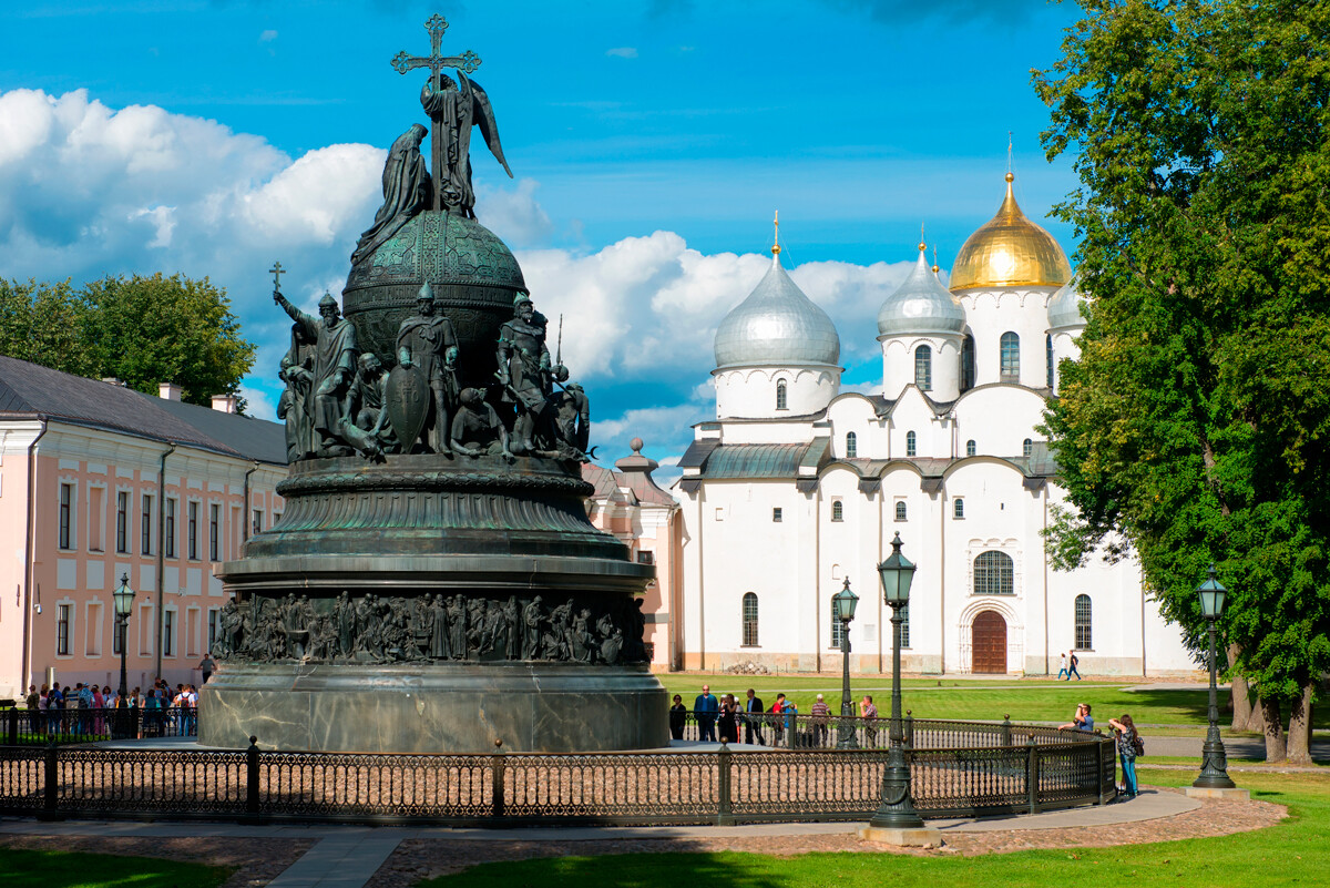The monument was erected at the Novgorod Kremlin. Cathedral of St. Sophia (built in 1050) is seen at the background