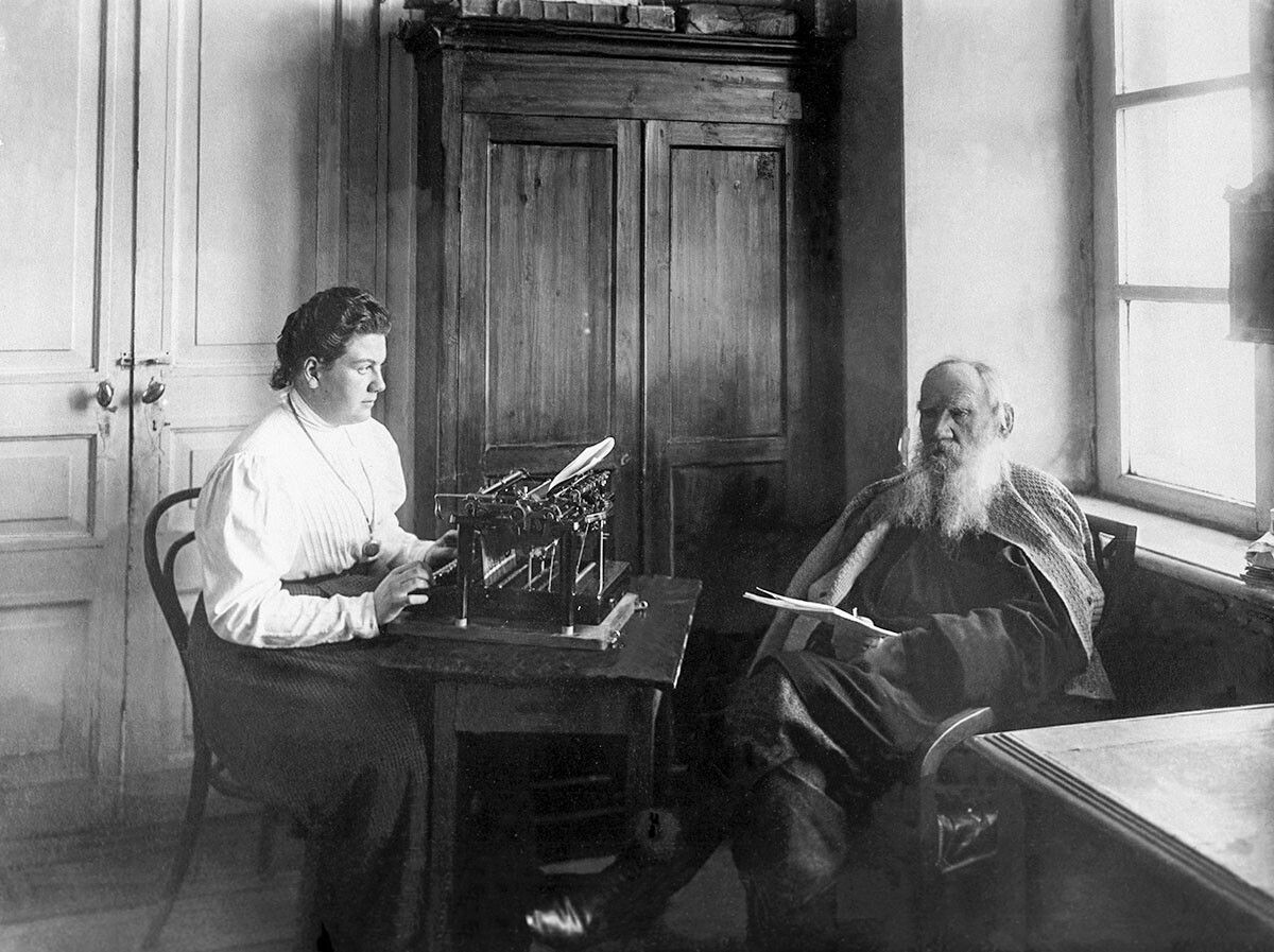 1909. Tula Gubernia, Russian Empire. Russian writer Leo Tolstoy and his daughter Alexandra work in the study at the Yasnaya Polyana estate. Tolstoy dictates a message for Alexandra to type. The photo was taken by Vladimir Chertkov, who was a friend, editor and publisher of Leo Tolstoy.