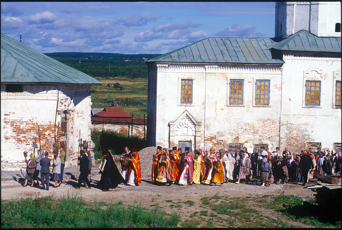 Ascension-Trinity Monastery. Historic photograph of Procession of the Cross from Church of St. Michael Malein to reconsecrate Church of Ascension/Trinity (left) which had been used as prison from 1938. August 12, 2000