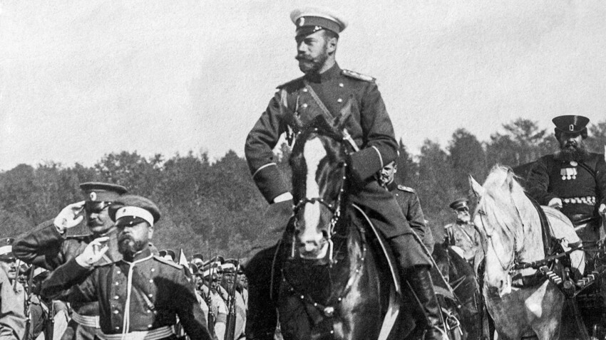 Nicholas II leads marching Russian soldiers along a road during the early days of World War I, 1914