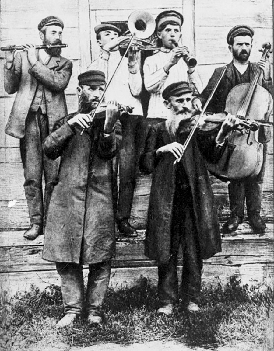 Klezmer musicians at a wedding, playing an accompaniment to the arrival of the groom, Ukraine, ca. 1925