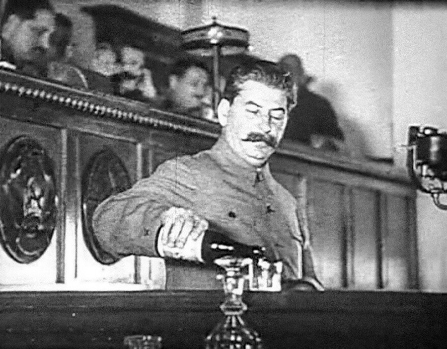 Stalin pouring himself some... water during a speech