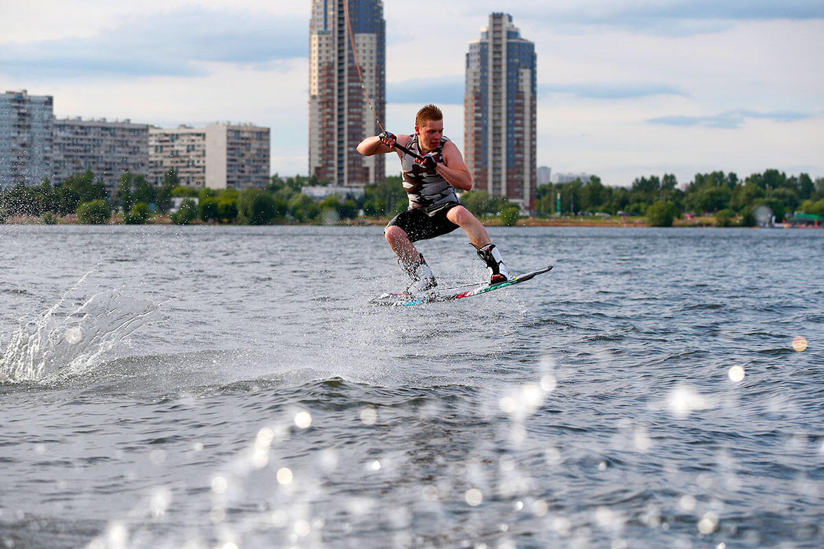 A man wakeboarding on the Moskva River in the Strogino District.