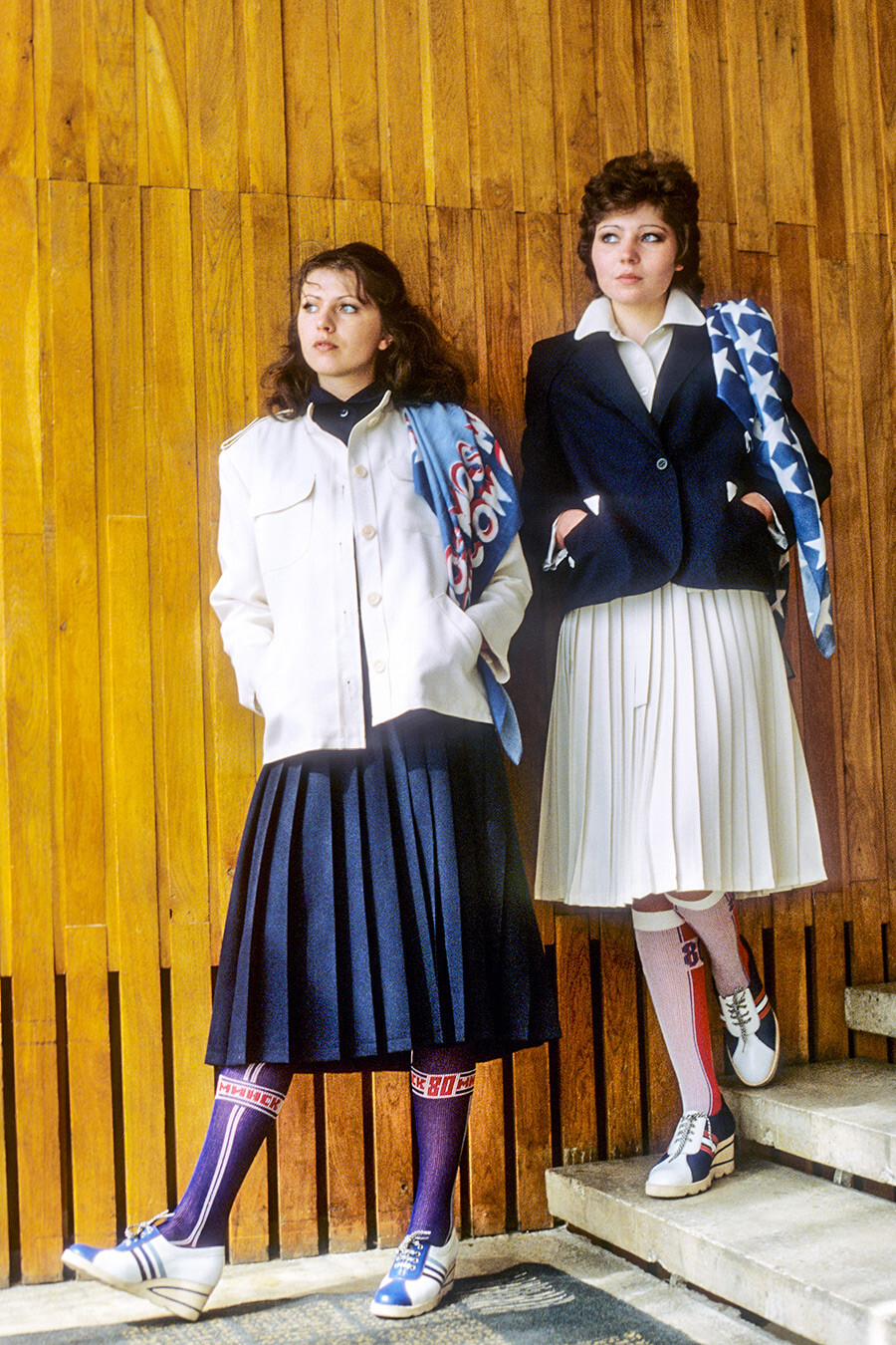 Models demonstrate women's outfits with the Olympic Games symbols. 