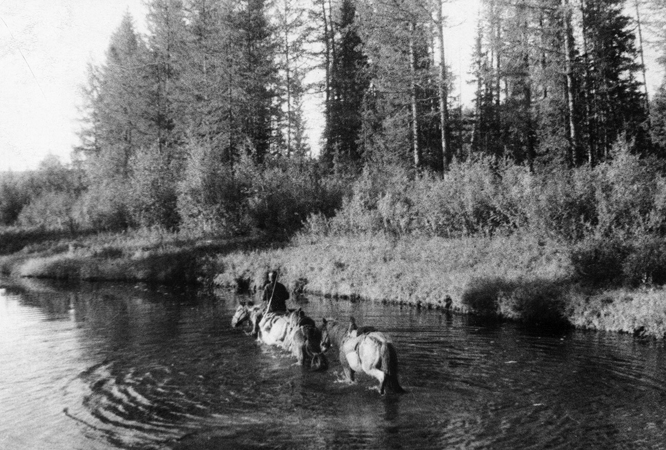 Professor Leonid Kulik is seen crossing the Khushmo river on horse back 7 km from where the meteorite fell in 1908.