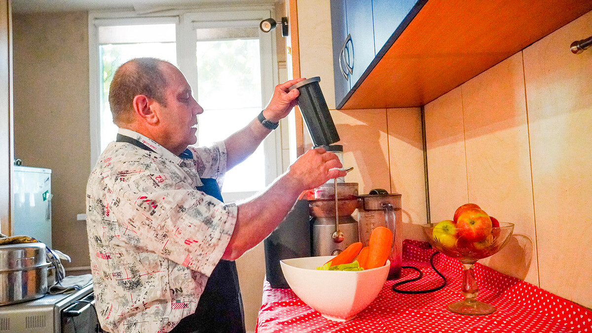 Making his daily juice