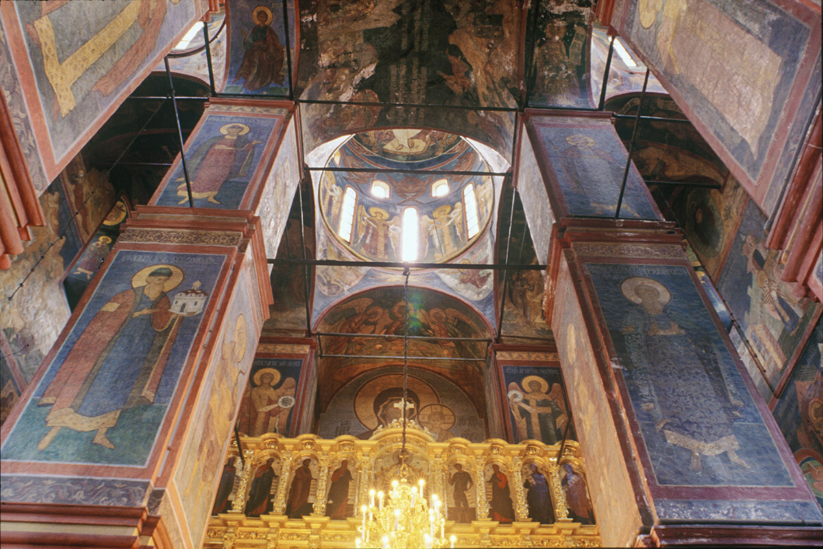 Cathedral of Smolensk Icon. Interior, view east toward icon screen & main dome. Left: north central pier with fresco of Grand Prince Vsevolod III holding model of Dormition Cathedral in Vladimir. May 25, 1997.