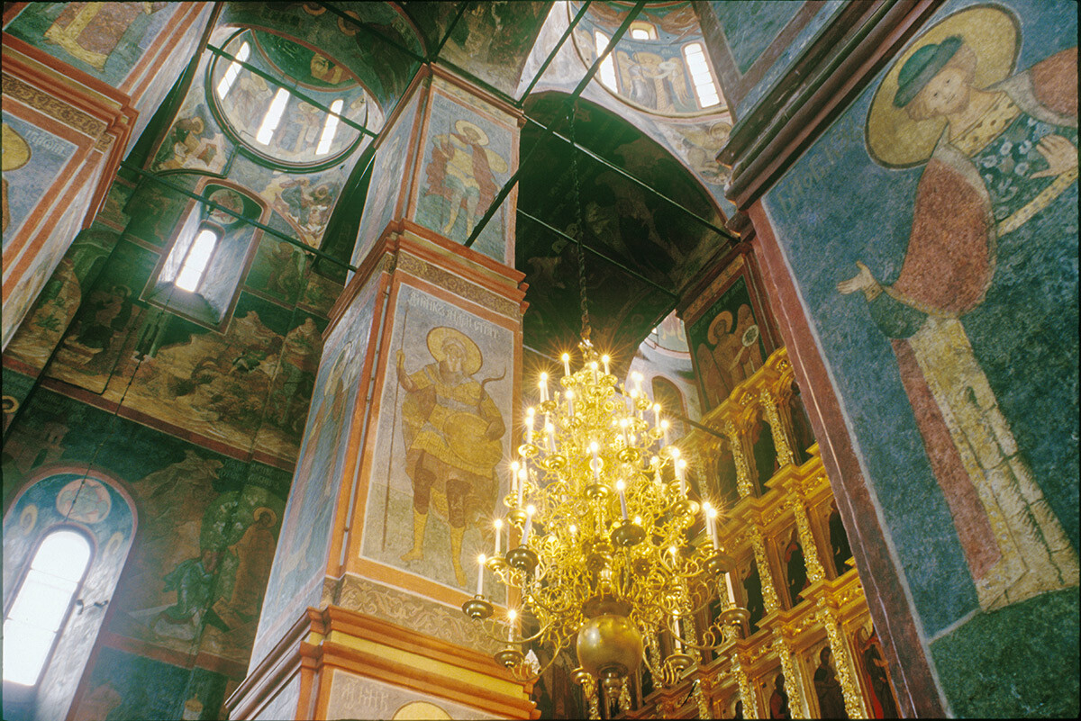 Cathedral of Smolensk Icon. Interior, view northeast toward icon screen. Right: south center pier with fresco of Saint Gleb. May 25, 1997.