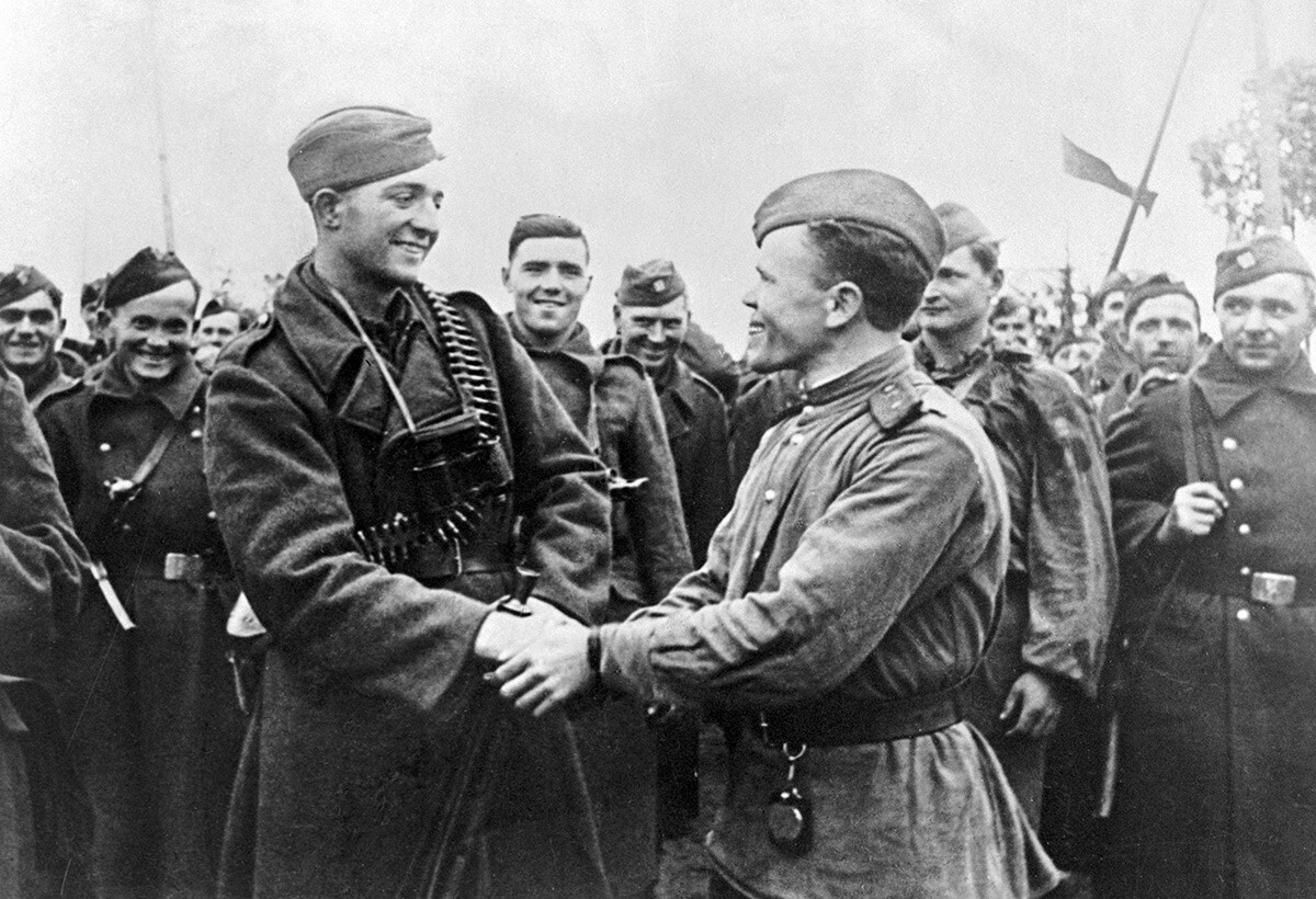 A Red Army officer congratulates Czechoslovak soldiers on the return to their homeland.