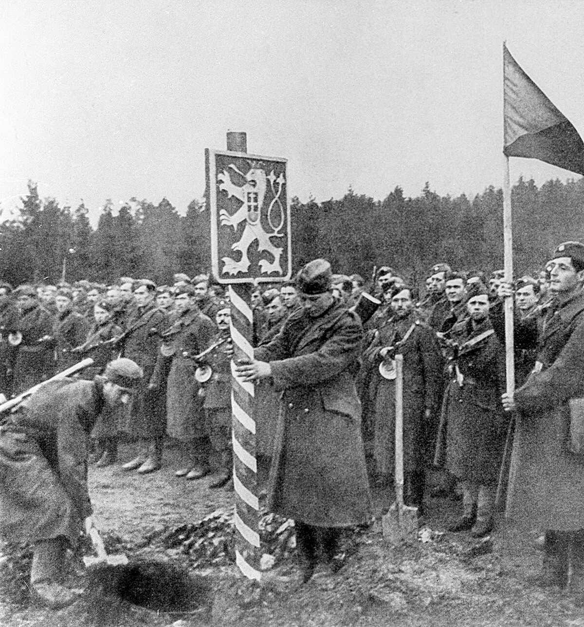 Czechoslovak soldiers install a border post.