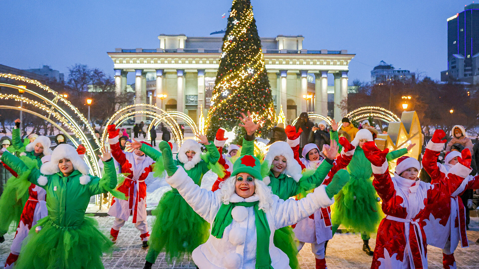 RUSSIA, NOVOSIBIRSK - DECEMBER 1, 2024: Artists perform near the main Christmas tree in Lenina Square decorated ahead of the holiday season.