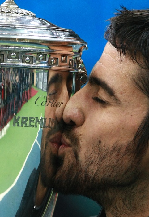 Serbia&#039;s Janko Tipsarevic holds the cup after his win over Serbia&#039;s Viktor Troicki in the 2011 Kremlin Cup Men&#039;s Singles final match.