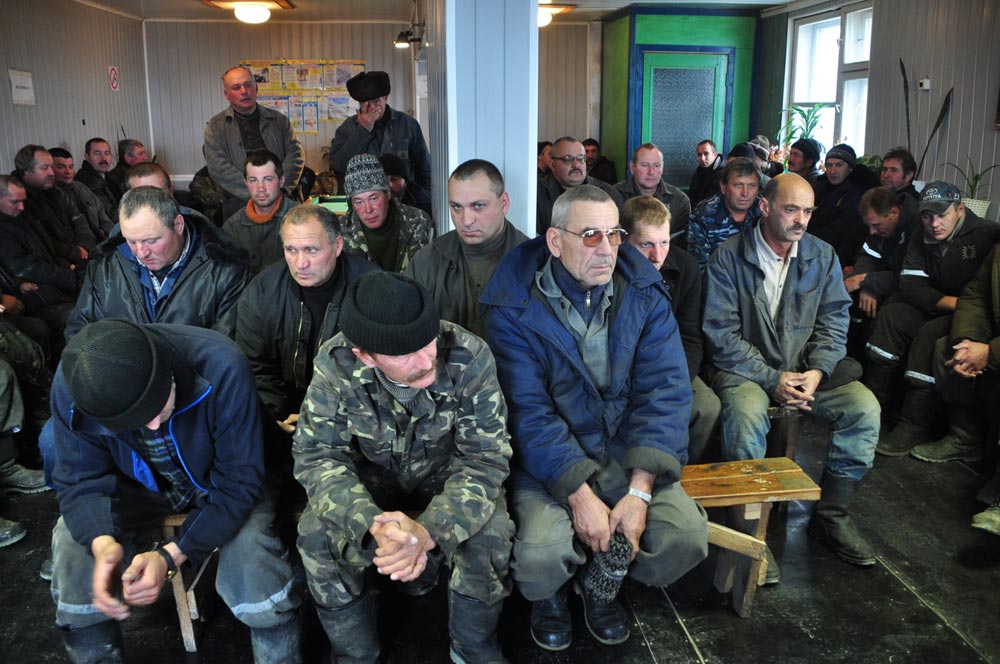 In a few minutes, these morose-looking men will set off to mine gold. Their shift lasts six months, followed by six months at home and then back to Chukotka. Many have lived this way for decades. 
