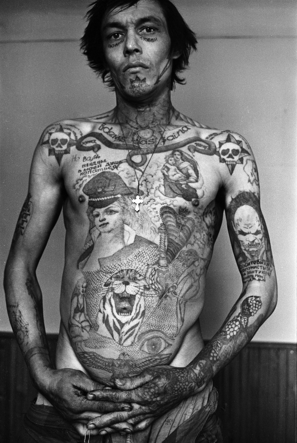 This prisoner’s tattoos signify that he feels angry and bitter with communist power (‘Communists, Suck My Dick for My Ruined Youth’). The tattoos on the face signify that he never expects to go free. the words underneath his eyes read: 'Full of Love'. He works as a stoker.