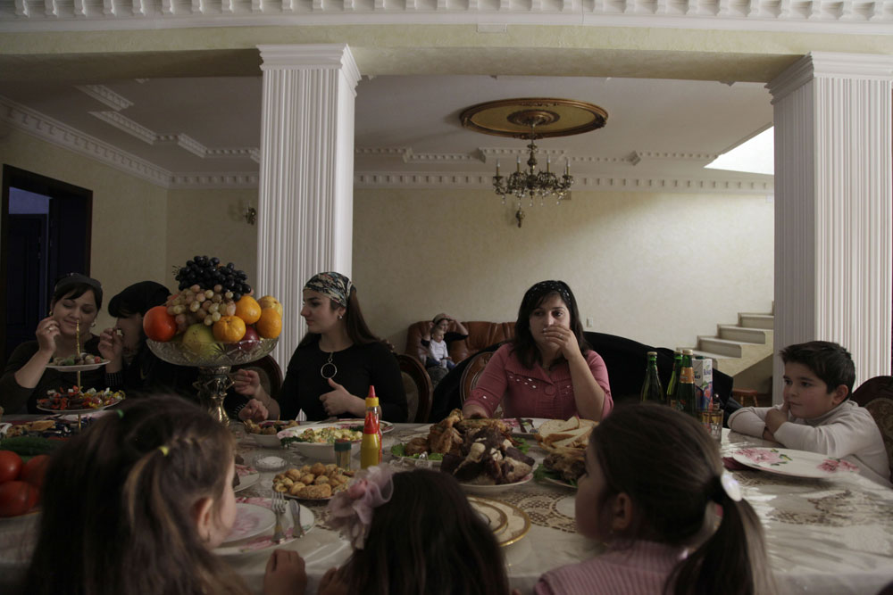 A Chechen family having a meal together.