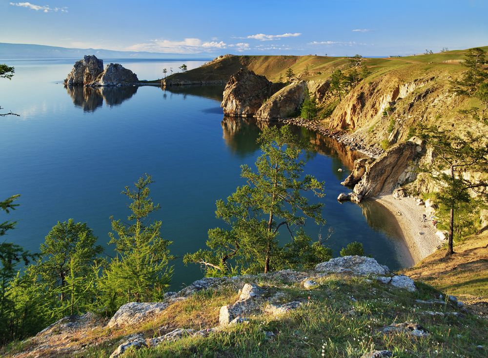 Lake Baikal ...is the world's oldest lake. According to the latest researches, Baikal exists more than 25 million years. Moreover, it is the deepest lake in the world, averaging 744.4 m. Located in the south of Siberia, between Irkutskaja Oblast to the northwest and the Republic of Buriatia to the southeast, it is the most voluminous freshwater lake in the world, containing roughly 20% of the world's unfrozen surface fresh water. In the list of UNESCO World Heritage since 1996.