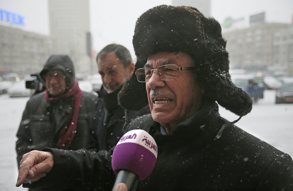 Syrian opposition member Hassan Abdul-Azim gestures as he speaks to reporters outside the Russian Foreign Ministry building in Moscow, Russia. Abdul-Azim and other opposition members held talks with Russian diplomats to discuss ways of settling the Syrian crisis.