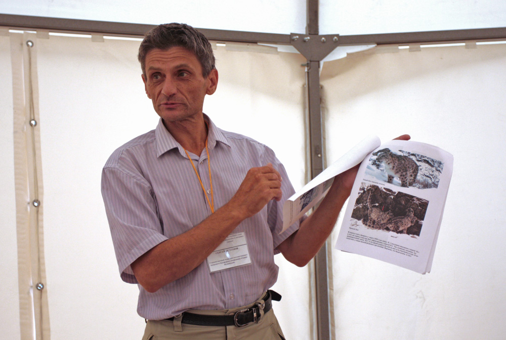The opening of the visitor center was timed to coincide with a three-day seminar on rare species of animals. Pictured is one of the participants, Sergei Istomov, an employee of the science department, with the "passport" of a snow leopard. Every animal "caught" by a camera trap has such a passport.