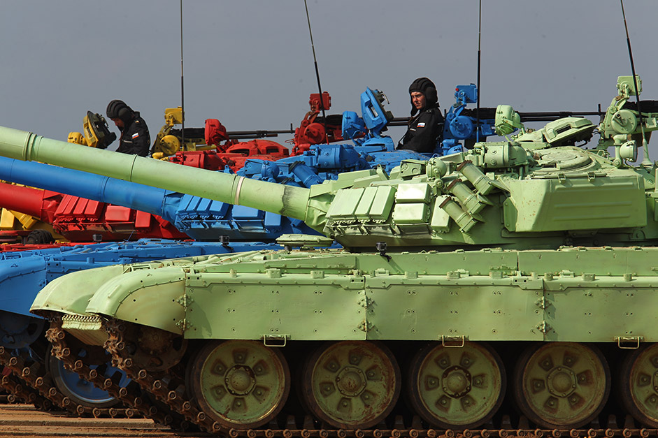 Crews work in four T-72B tanks that are painted red, green, yellow, and blue to make them more visible and to better determine if they accomplished their goals.