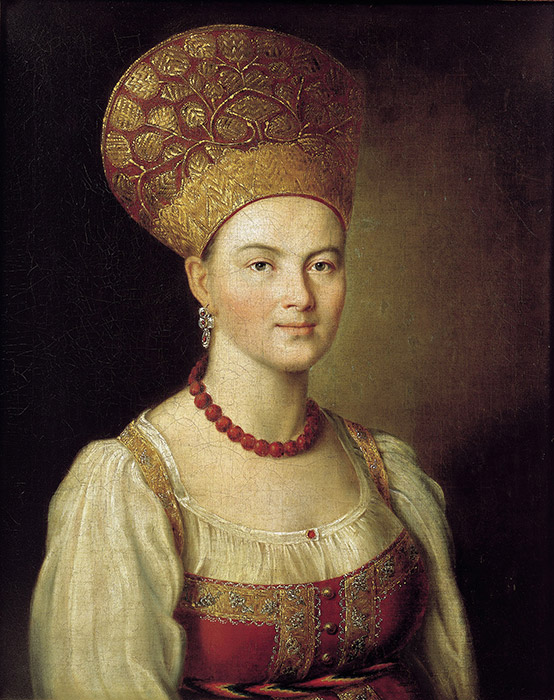 ココシニクには様々な形状があり、地域差があったが、頭髪を束ね上げるか2つの三つ編みにするかの伝統によって左右されることが多かった。それにはおでこにかかって頭全体を覆うもの、首にかかるもの、側頭にかかるものなどがある。/イヴァン・アルグノフ、小作農の女性の肖像。