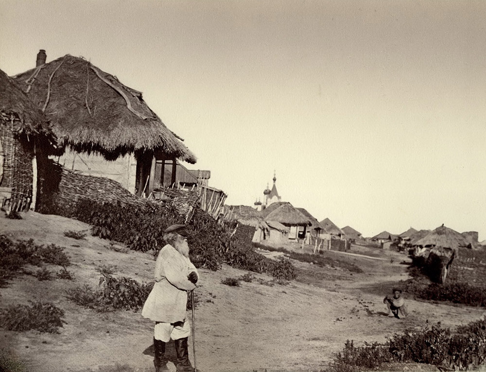 His interest in photography led him to Saint Petersburg where he entered the service of the Lorentz photo workshop. Later, he then began attending classes as a volunteer at the Academy of Arts, though he did not graduate it due to a lack of funds. / A Street in Kumshatskaya Village