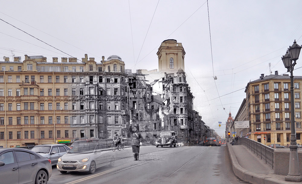 A woman directs traffic in front of a bombed-out building at the intersection of Voznesensky Prospekt and the Fontanka River.