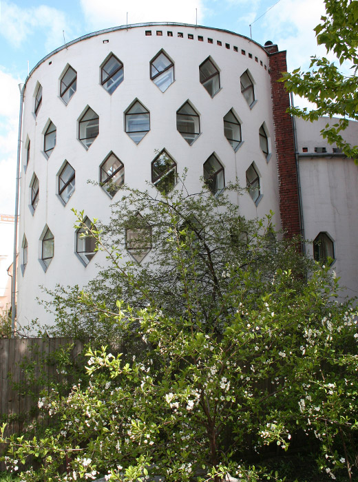 Melnikov House, 10 Krivoarbatsky Lane. // This single-unit house, built by the great Soviet avant-garde architect Konstantin Melnikov for his family, is today an architectural monument of national significance. It is unique for its shape — two intersecting cylinders each truncated by a third of its radius — and its hexagonal window apertures encircling the entire circumference of the building. There are 60 windows in total, while the apertures in the walls number more than 130 — all stuffed with brick and construction debris (not a single wheelbarrow of waste was removed from the site!), but able to be unblocked to create a new window anywhere in the walls. Melnikov placed such windows in all the walls so that his hand never overshadowed a blueprint in his studio. The internal area of the house is very modest — a mere 2691 ft². Melnikov’s descendants live here to this day.