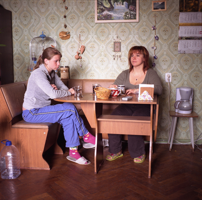 Marina (left), a realtor, eating her breakfast with her daughter, Arina. Marina and two of her three children share a 30 square-meter room where they moved about a month before this picture was taken after she divorced her husband. Most Russians like to eat in their kitchens, but those who live in communal housing cannot, so they have to eat in their rooms.