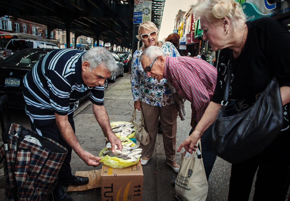 Fishermen selling his fresh catch on the street in Brighton Beach, New York. October 6, 2012