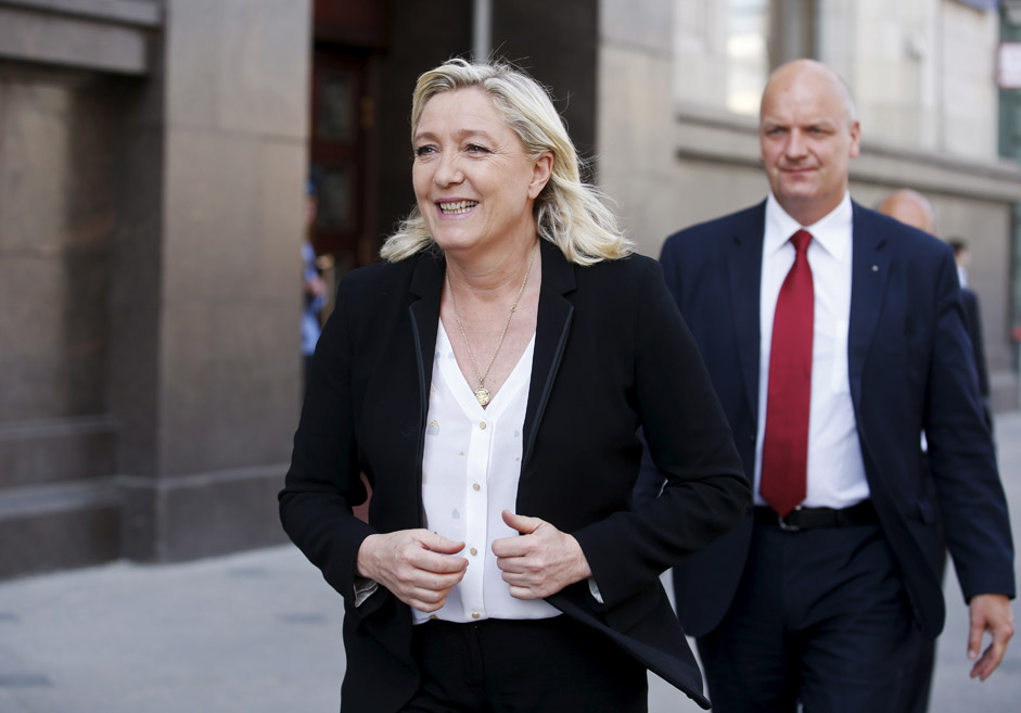 Marine Le Pen, the leader of France's far-right National Front party, walks after leaving the building of the State Duma, the lower house of parliament, in central Moscow, Russia, May 26, 2015. Marine Le Pen arrived for meetings in the Russian parliament building in Moscow. 