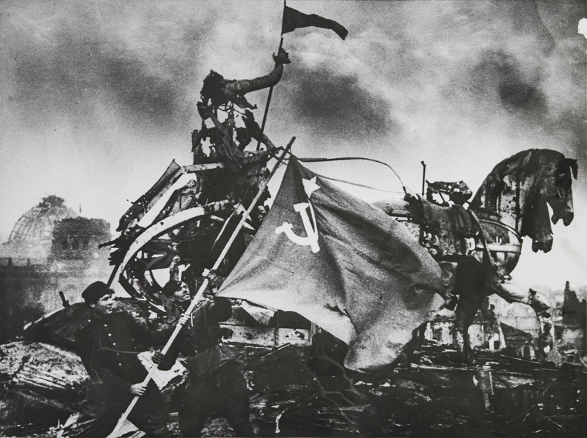 Interest in his work picked up towards the end of his life and, in 1995 at the Perpignan International Festival of Photojournalism, he was awarded the title of Knight of the Order of Arts and Letters, one of France's highest cultural awards./  The flag of victory on the Brandenburg Gates, Berlin, 1945. 