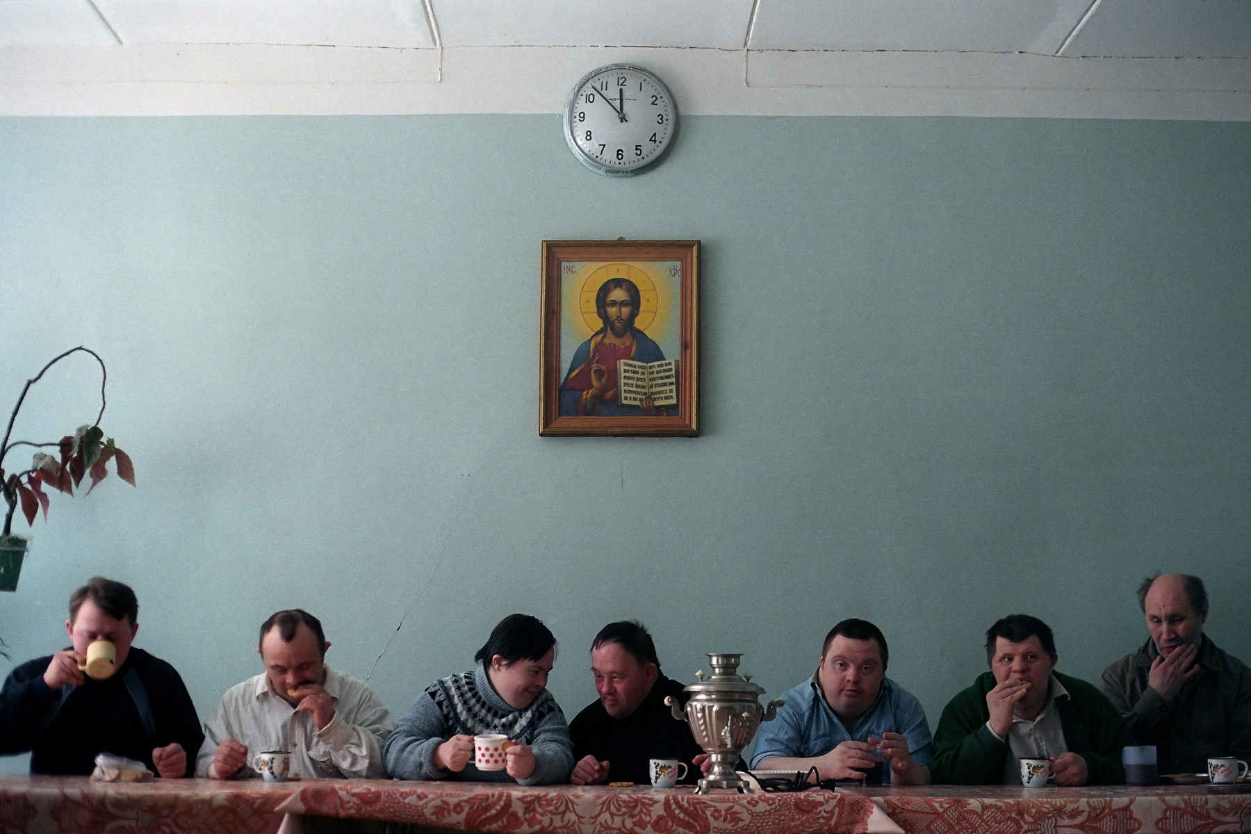 This photo, “Amateur troupe of the Naïve Theatre drinking tea. Psycho-neurological boarding school №7, St. Petersburg, 2003”, was chosen as the winner of World Press Photo 2004 in the category of Arts and Entertainment.