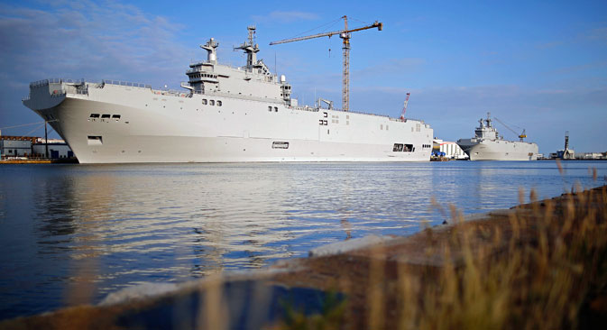 Two Mistral-class helicopter carriers Sevastopol (L) and Vladivostok are seen at the STX Les Chantiers de l'Atlantique shipyard site in Saint-Nazaire, western France, May 21, 2015. Russia wants 1.163 billion euros ($1.32 billion) in compensation from France for cancelling a contract to deliver two Mistral helicopter carriers, a Russian source close to the negotiations said last week.
