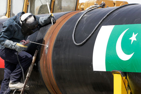  An Iranian worker welds two gas pipes at the beginning of construction of a pipeline to transfer natural gas from Iran to Pakistan, at the mile 250 in southeastern Iran, near the Pakistani border, Monday, March 11, 2013. The leaders of Pakistan and Iran on Monday pushed ahead with a pipeline to bring natural gas from Iran despite American opposition, with the Iranian president saying the West has no right to block the project