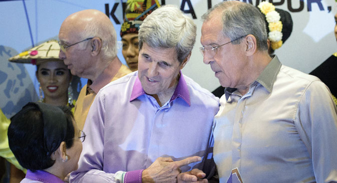 Indonesia’s Foreign Minister Retno L.P. Marsudi. left back to camera, US Secretary of State John Kerry, centre, and Russia's Foreign Minister Sergey Lavrov, speak before an ASEAN Gala in Kuala Lumpur