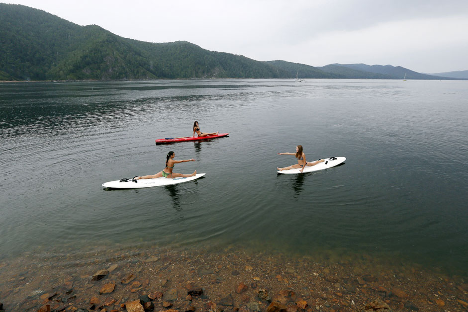 Girls practice board yoga on the Yenisei River outside the Siberian city of Krasnoyarsk, on Aug. 24. Source: Reuters