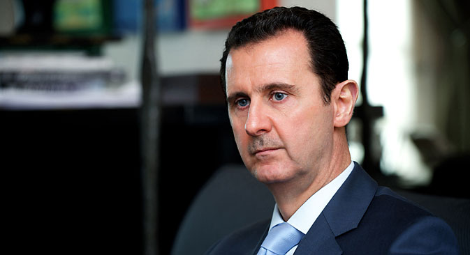 A handout picture released by the Syrian Arab News Agency (SANA) on January 15, 2015 shows Syrian President Bashar al-Assad giving an interview to the Eterarna Novina Czech newspaper in Damascus. Coalition strikes against the Islamic State group are having no impact, Assad said in an interview, as members of the US-led offensive claimed to be winning. 