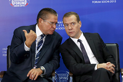 Russian Prime Minister Dmitry Medvedev (right) and Minister of Economic Development Alexei Ulyukayev attend the round table 'Investment Climate At The Local Level. Keys To Success' at the International Investment Forum Sochi 2015.