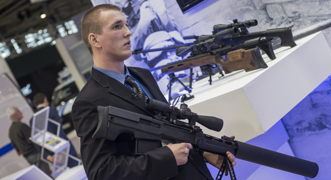 A staffer holds a silent anti-materiel rifle "Vykhlop" presented on the stand of Rostech companyat the International Exhibition of Homeland Security Interpolitex 2015.