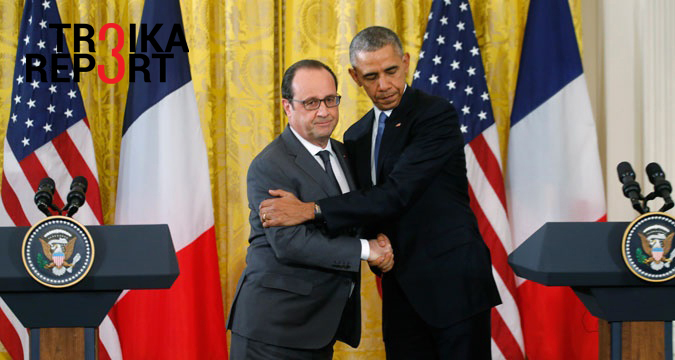 U.S. President Barack Obama (R) greets French President Francois Hollande during a joint news conference in the East Room of the White House in Washington, Nov. 24, 2015