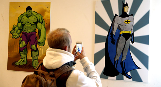 Vladimir Putin as comicbook characters 'The Incredible Hulk' (L) and as Gotham City super-hero protector 'Batman' (R). Source: EPA