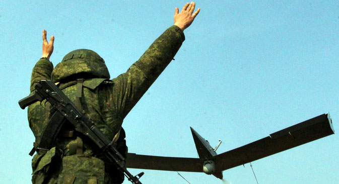 A soldier launches a small unmanned aerial vehicle complex "Zastava" during the teaching of complex tactical artillery and reconnaissance units 83rd Guards Paratroops Brigade Airborne in the Primorsky Territory.